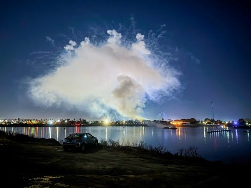 A cloud of fireworks smoke from one of 150 SeaWorld fireworks shows per year that pollute Mission Bay.